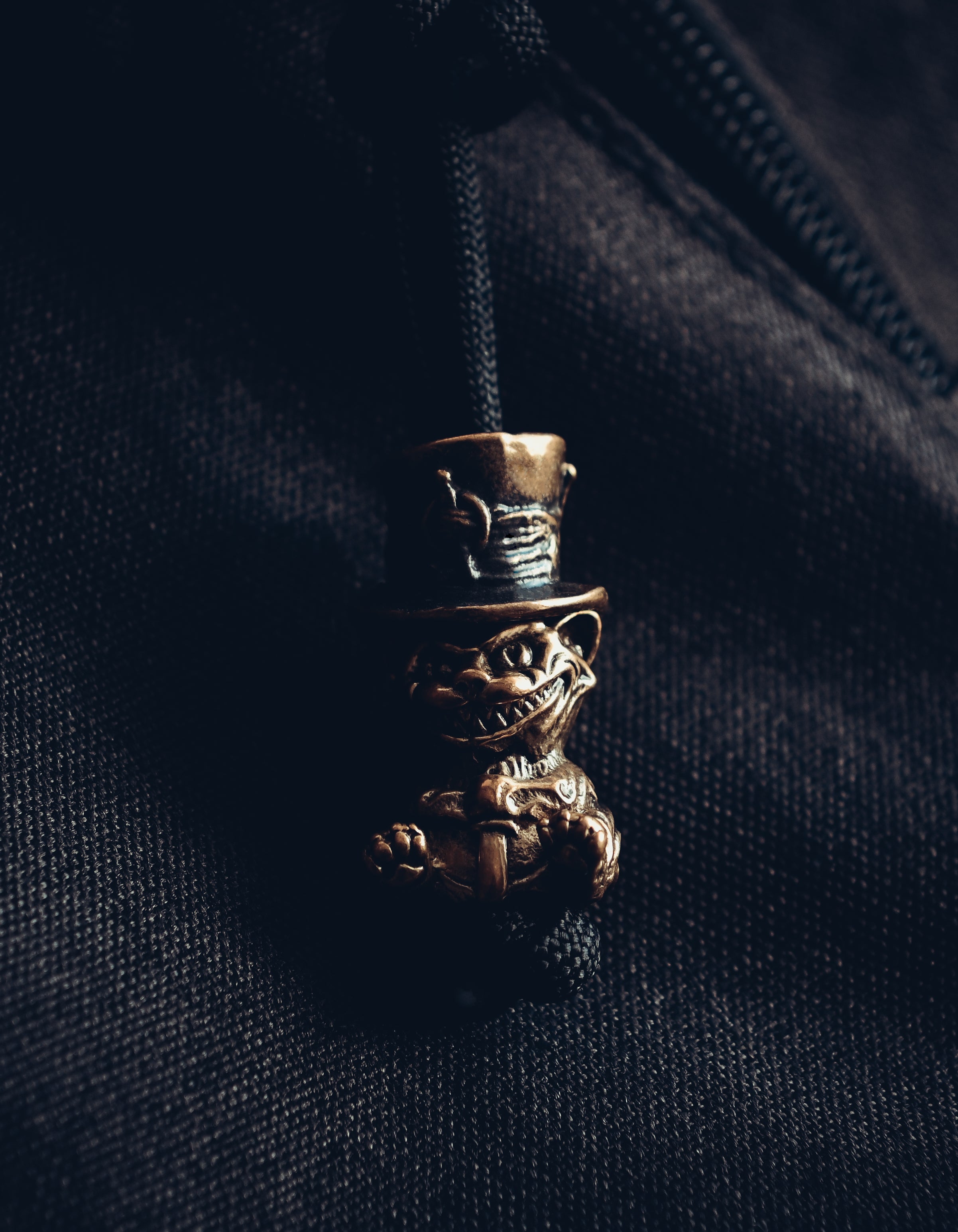 Cheshire Cat Keychain, Bronze on Paracord Cord