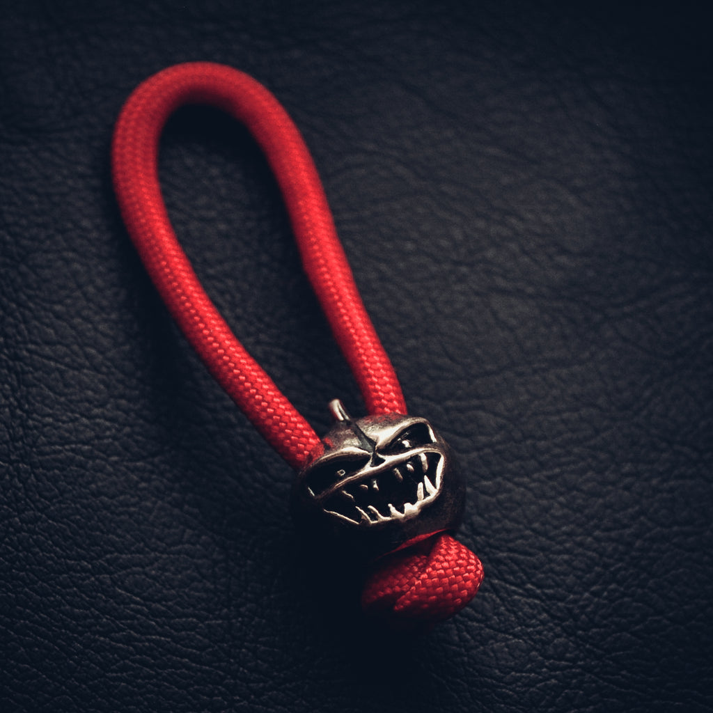 Angry Pumpkin Keychain, Bronze on Paracord Cord